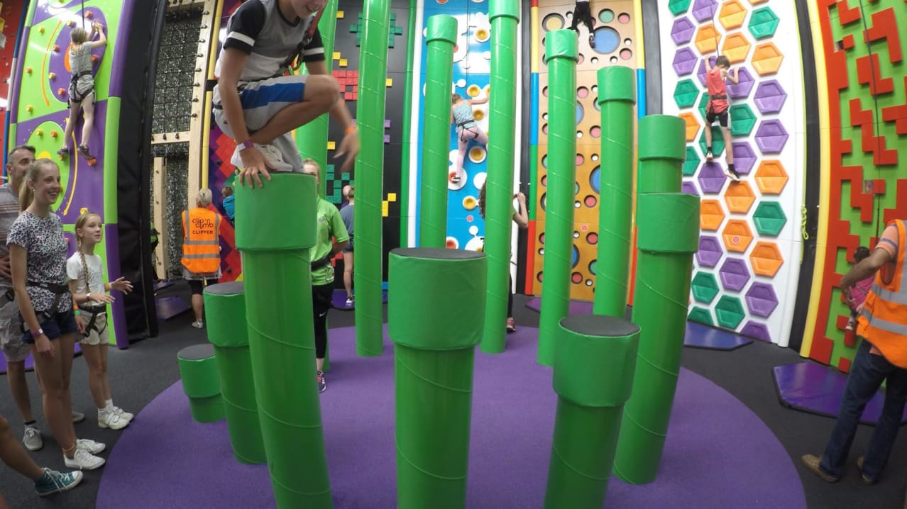 Boy on climbing at Clip n Climb Cambridge Boy on climbing at Clip n Climb Cambridge
