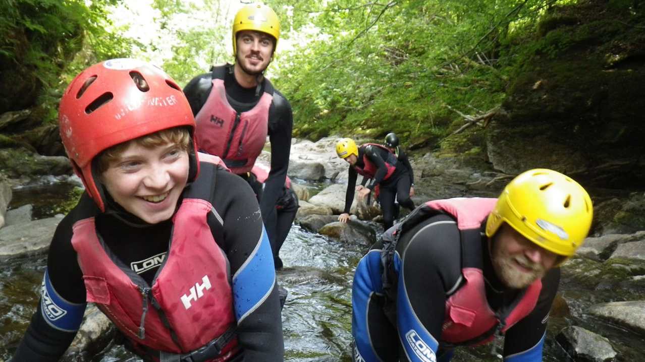 Family canoeing at Splash White Water Rafting in Aberfeldy