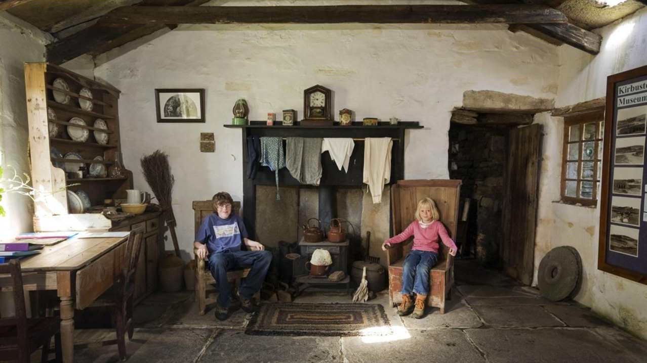 Kids in 'living museum' room at Kirbuster Museum in The Orkney Isles