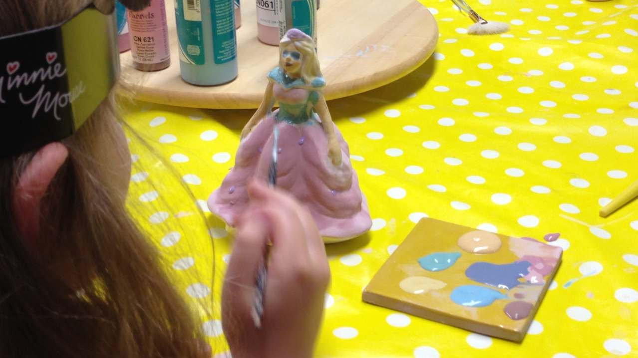 Girl painting princess at Wot Pots in Bristol Girl painting princess at Wot Pots in Bristol