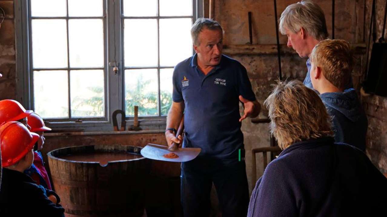 Staff talking to visitors at Geevor Tin Mine in Penzance