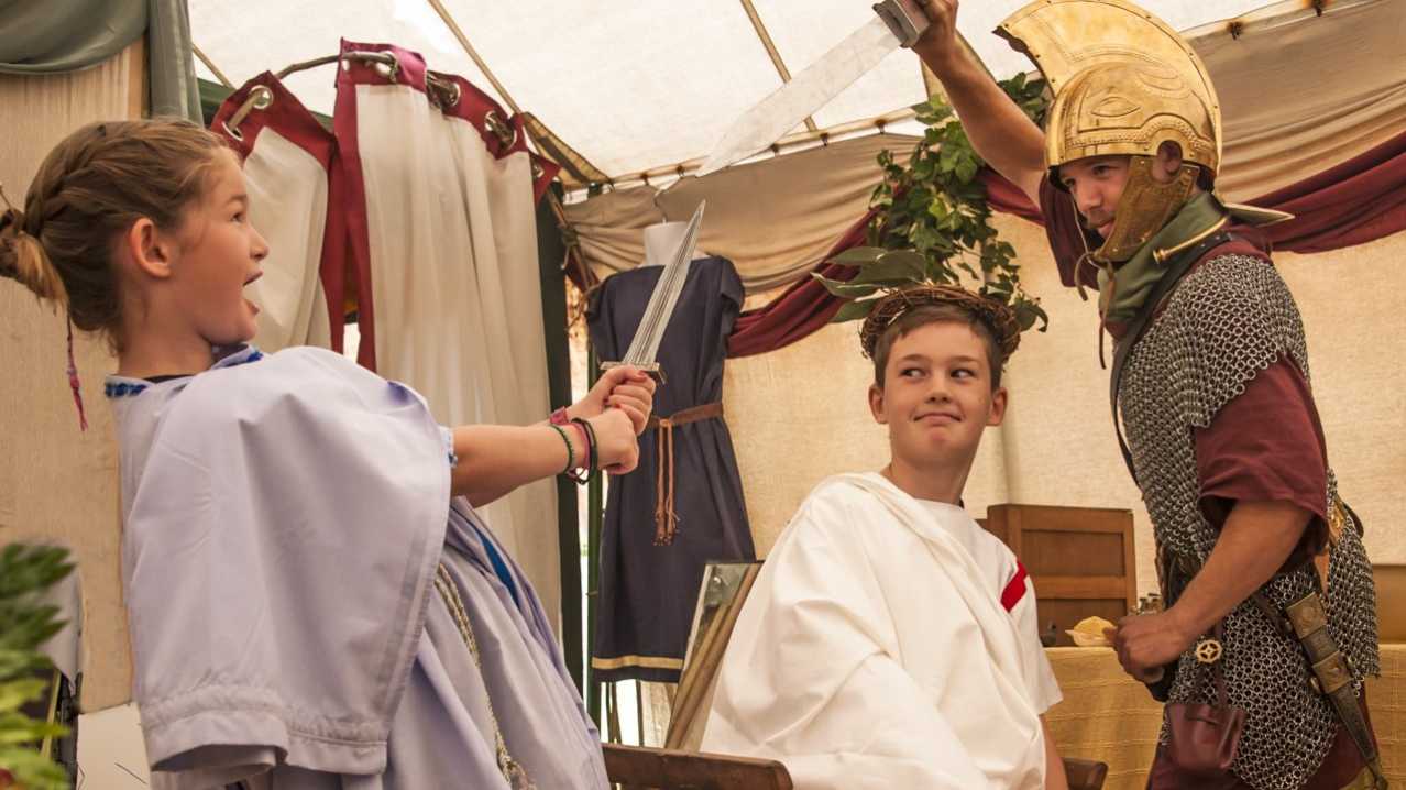 Kids dressed as romans at Butser Ancient Farm in Waterlooville