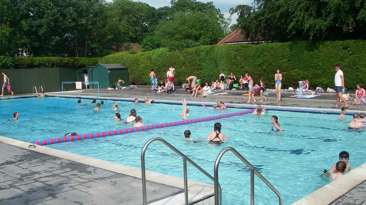 People swimming in outdoor pool at Petersfield Pool People swimming in outdoor pool at Petersfield Pool