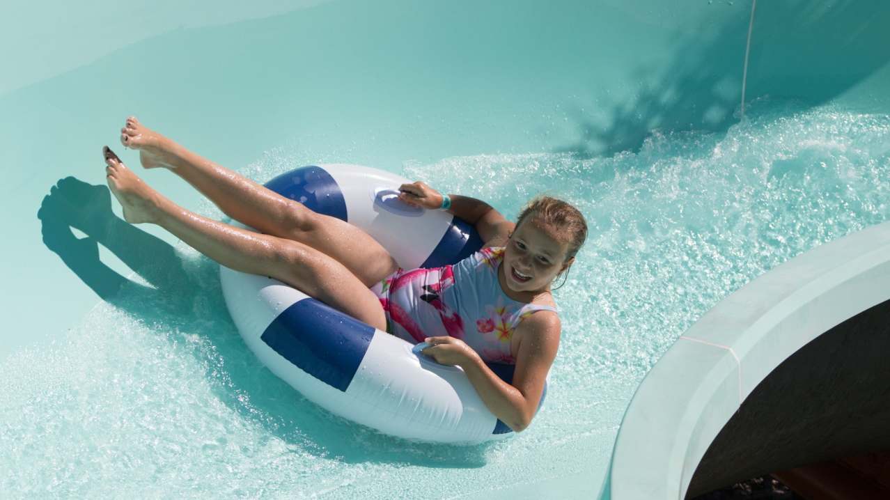 Girl on flume at Splashdown Quaywest Waterpark in Paignton
