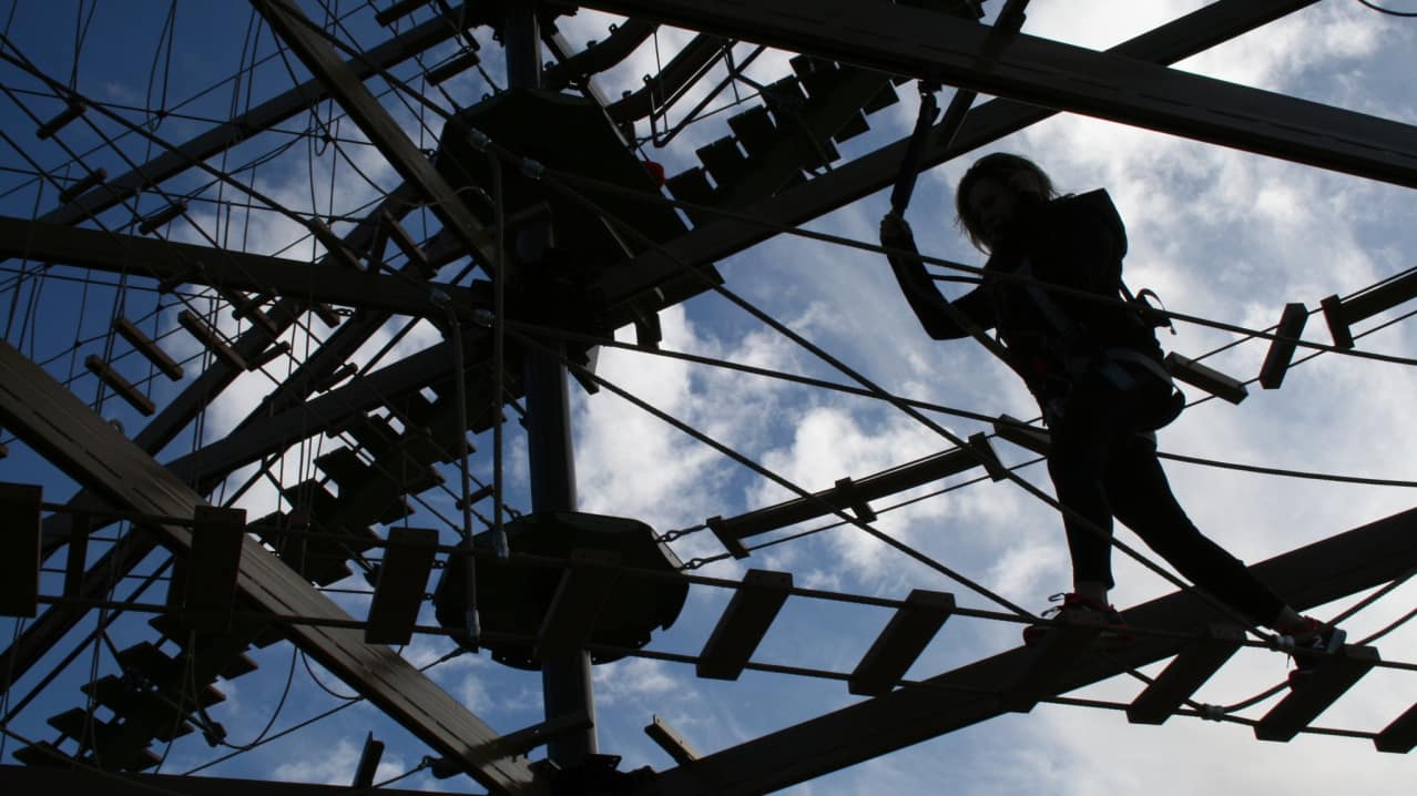 Girl on high rope course at Air Trail in Stockton-on-Tees Girl on high rope course at Air Trail in Stockton-on-Tees