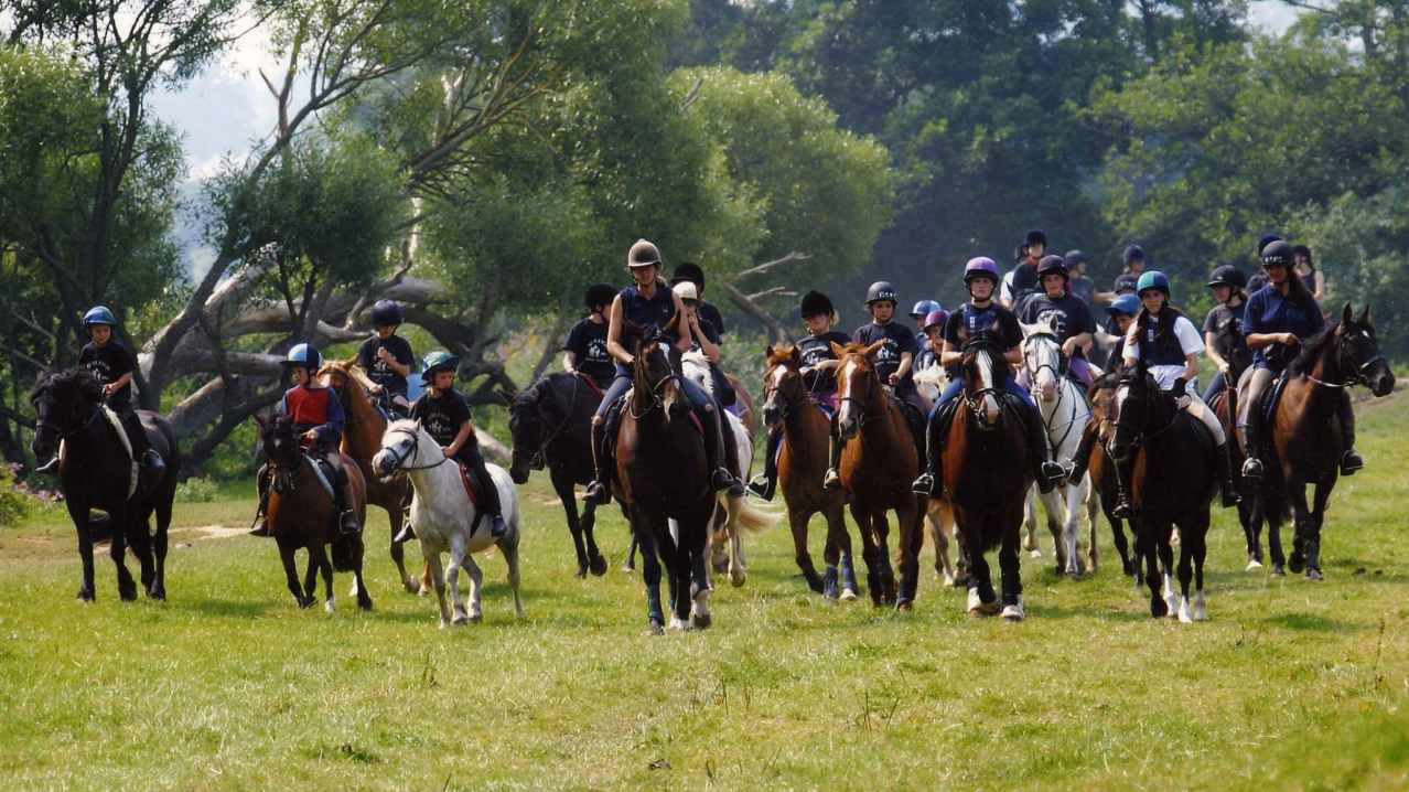 People riding horses at Budleigh Salterton Riding School