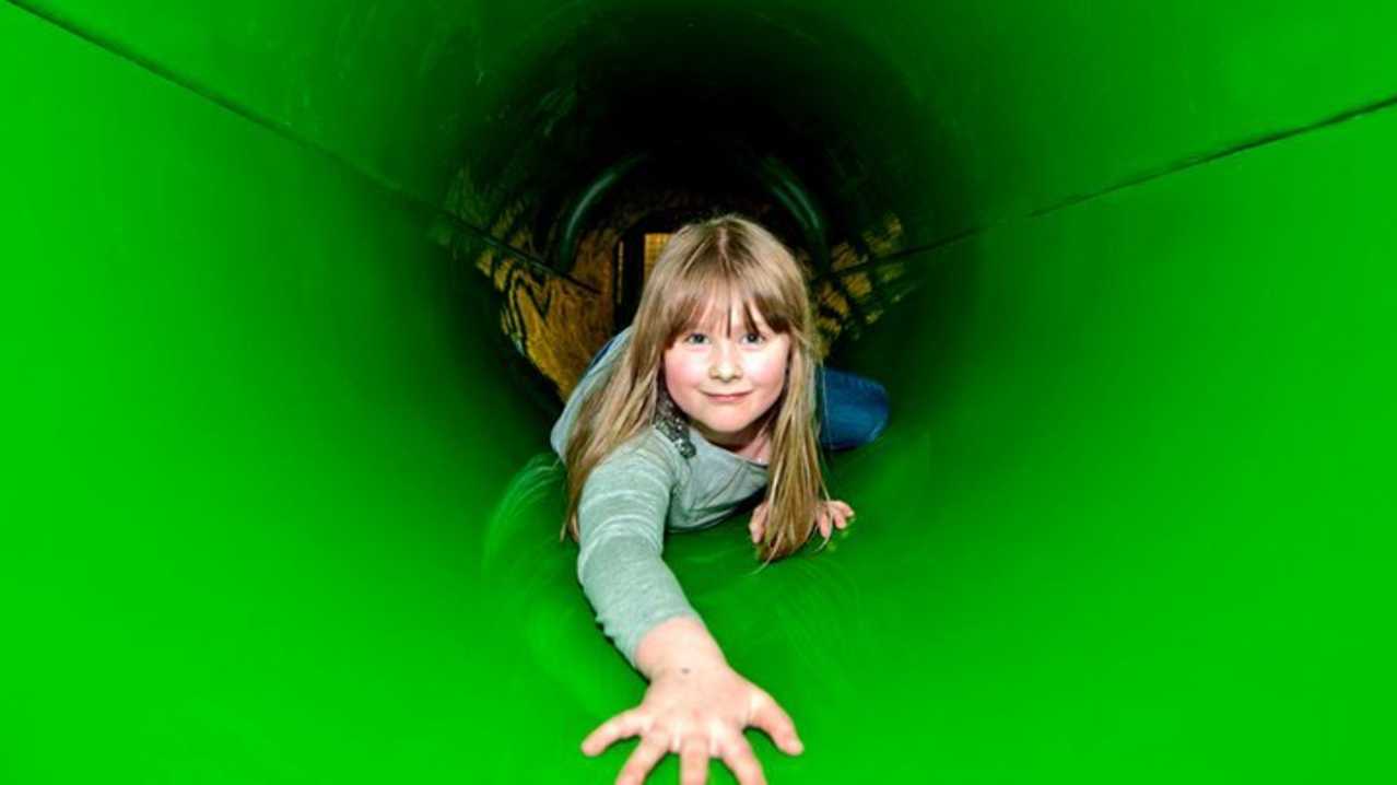 Girl in tunnel at Jungle Kids in Leeds