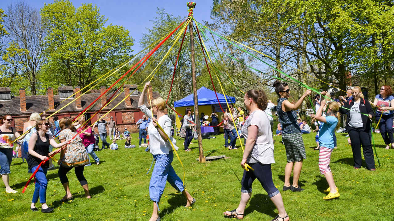 People do maypole dance at Avoncroft Museum of Historic Buildings in Bromsgrove