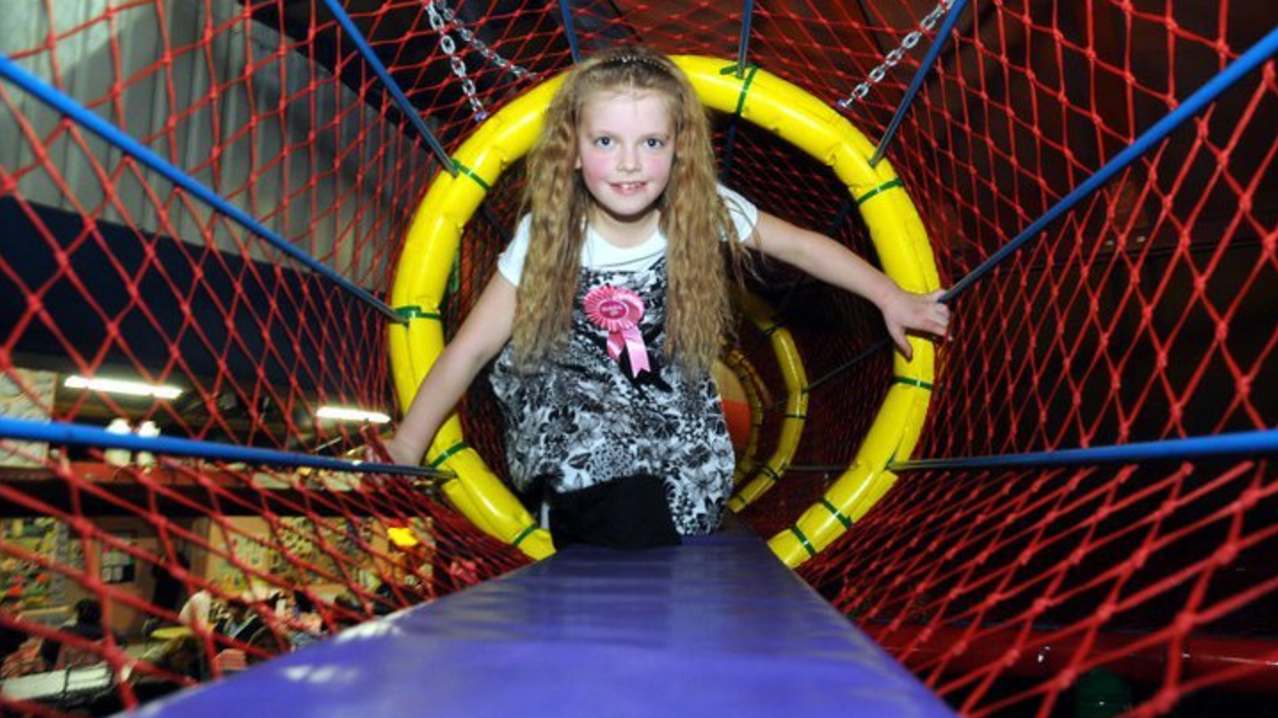 Girl on soft play frame at Mickey Millers Family PlayBarn in Craven Arms Girl on soft play frame at Mickey Millers Family PlayBarn in Craven Arms