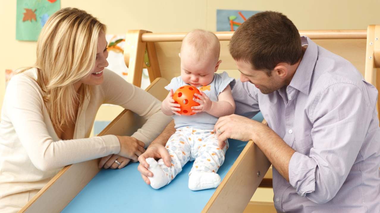 Parents playing with baby at Gymboree Play Sevenoaks