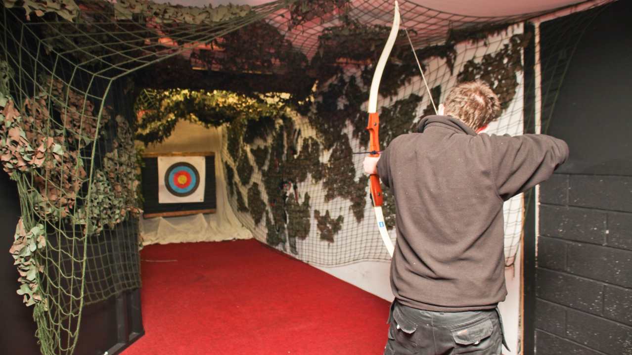 Man doing archery at The Zone Extreme Activity Centre in Navan Man doing archery at The Zone Extreme Activity Centre in Navan