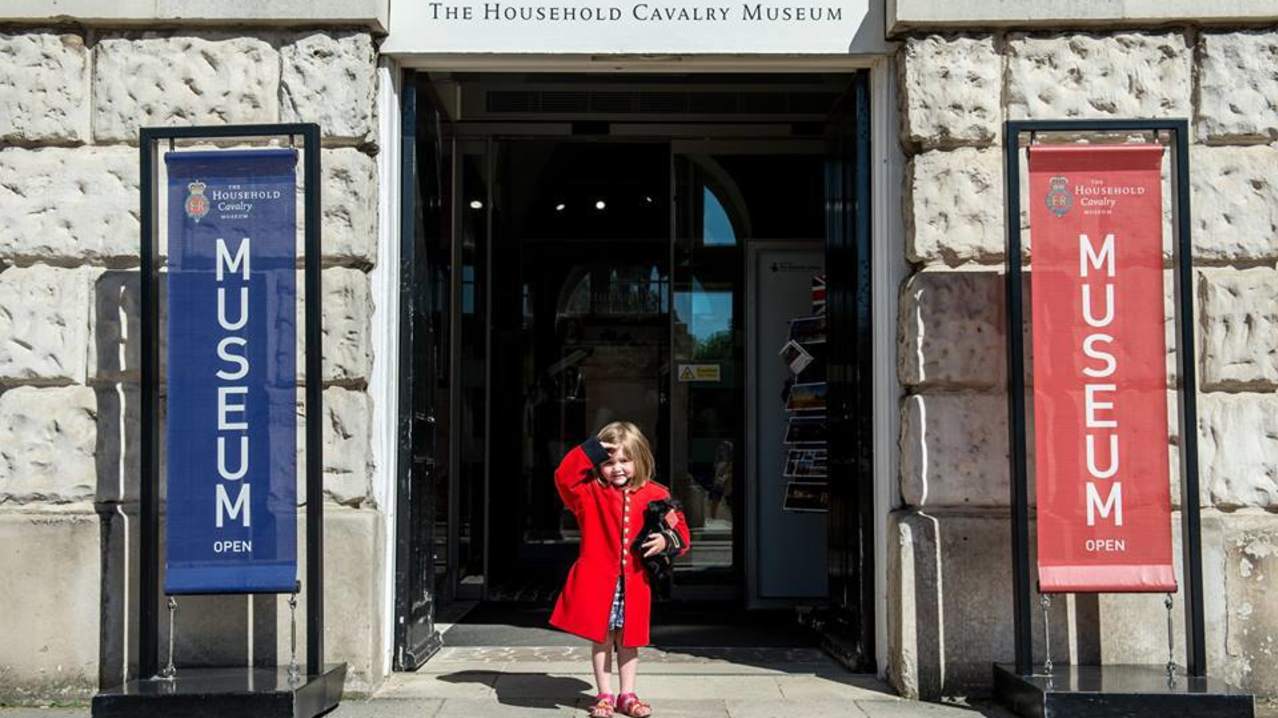 Girl at entrance of The Household Cavalry Museum in London