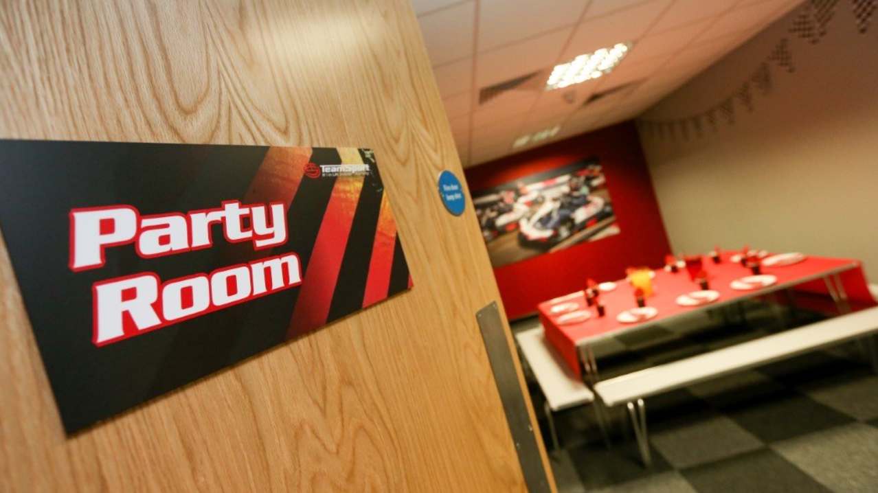 The sign for the party room at TeamSport Indoor Karting Manchester Trafford Park