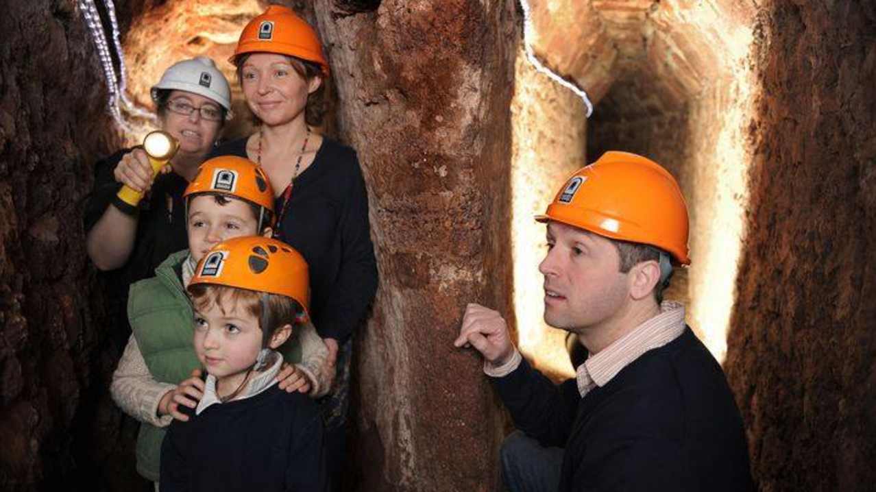 Families exploring Exeters Underground Passages