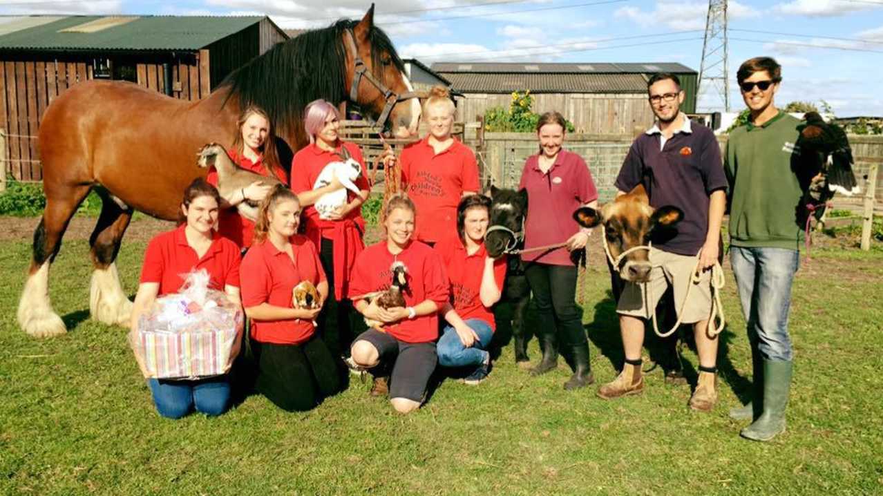 Staff with animals at Ash End House Children's Farm in Tamworth Staff with animals at Ash End House Children's Farm in Tamworth