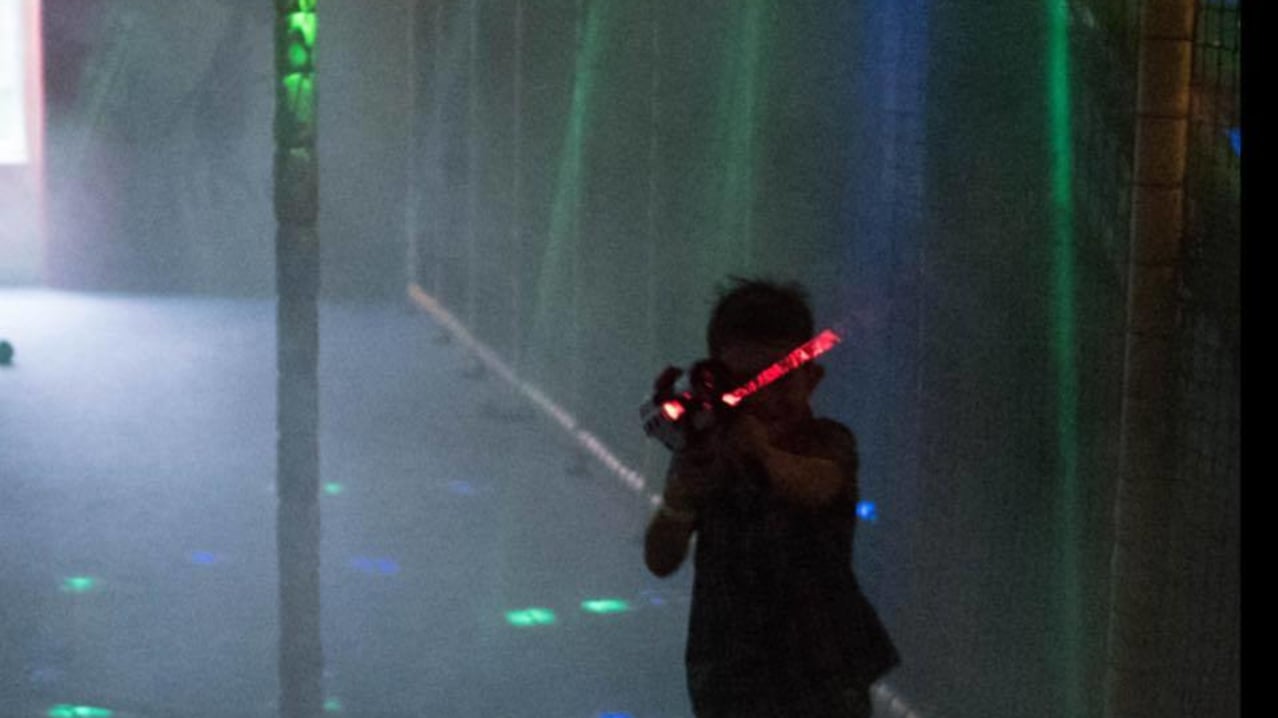Boy playing laser tag at Play Planet Soft Playcentre in Hereford Boy playing laser tag at Play Planet Soft Playcentre in Hereford