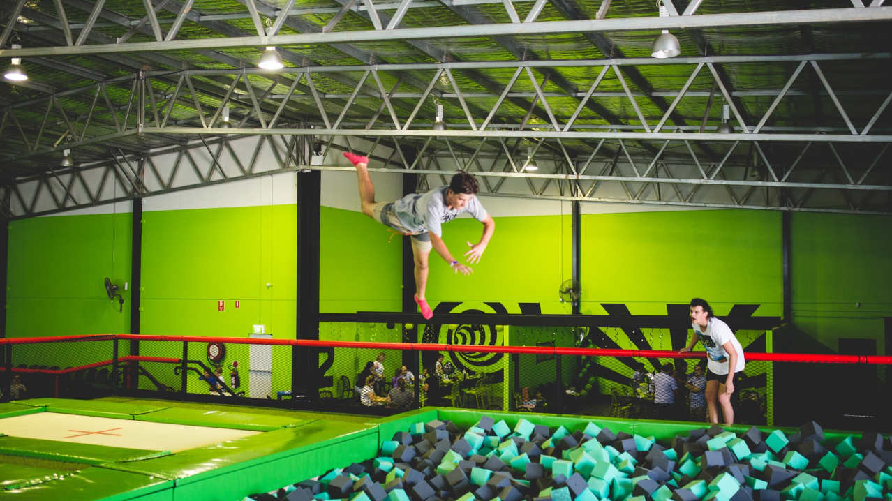 Boy jumping into foam pit at Flip Out Sandwell in Oldbury Boy jumping into foam pit at Flip Out Sandwell in Oldbury