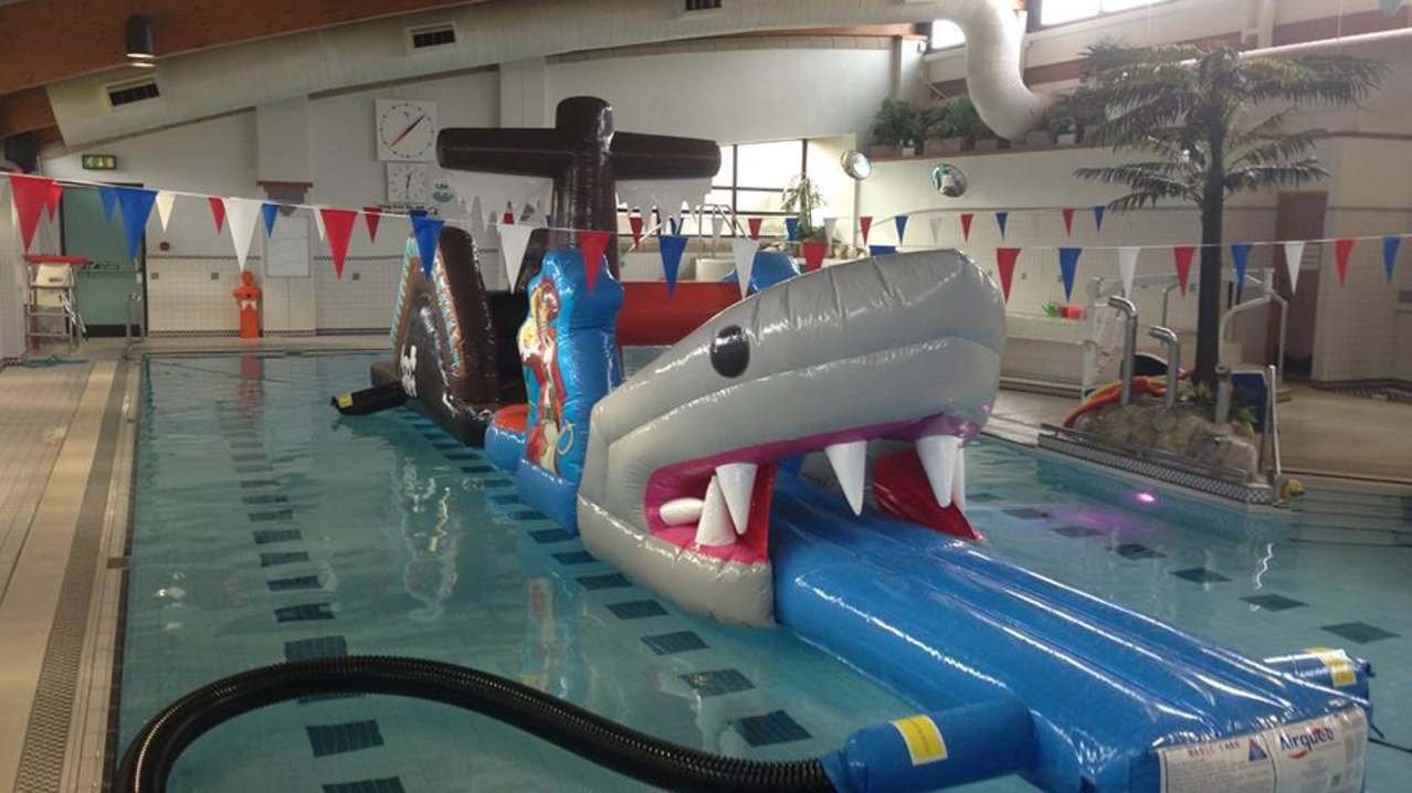 Inflatable assault course in swimming pool at Scalloway Pool in Shetland Isles Inflatable assault course in swimming pool at Scalloway Pool in Shetland Isles