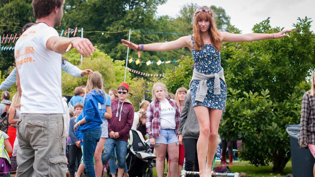 Girl on balancing rope at Howard Park and Gardens in Letchworth