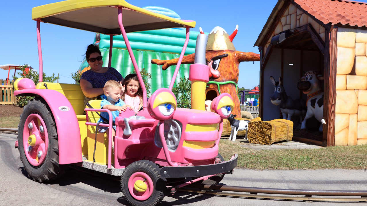 Family on ride at Old MacDonalds Farm & Fun Park in Padstow Family on ride at Old MacDonalds Farm & Fun Park in Padstow