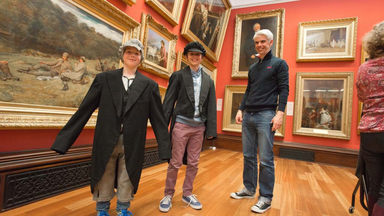 Boys in costumes in Victoria Gallery at The McManus Art Gallery and Museum in Dundee
