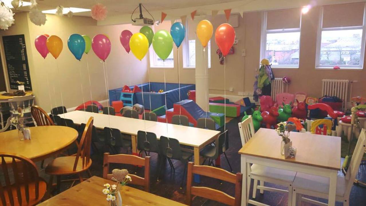 Dining tables and play area at The Little Play Cafe in South Shields Dining tables and play area at The Little Play Cafe in South Shields