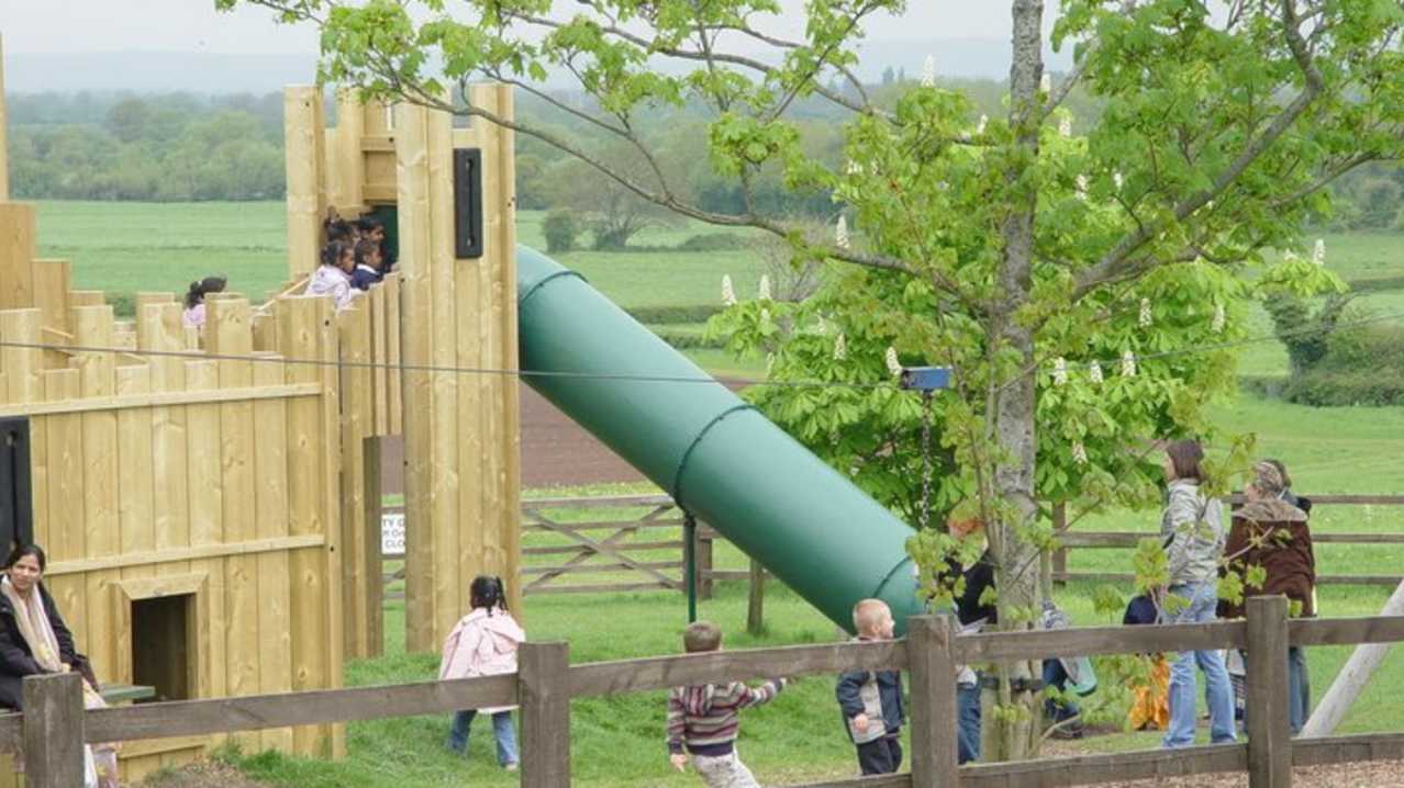 Kids playing on adventure playground at Court Farm Country Park in Weston Super Mare Kids playing on adventure playground at Court Farm Country Park in Weston Super Mare