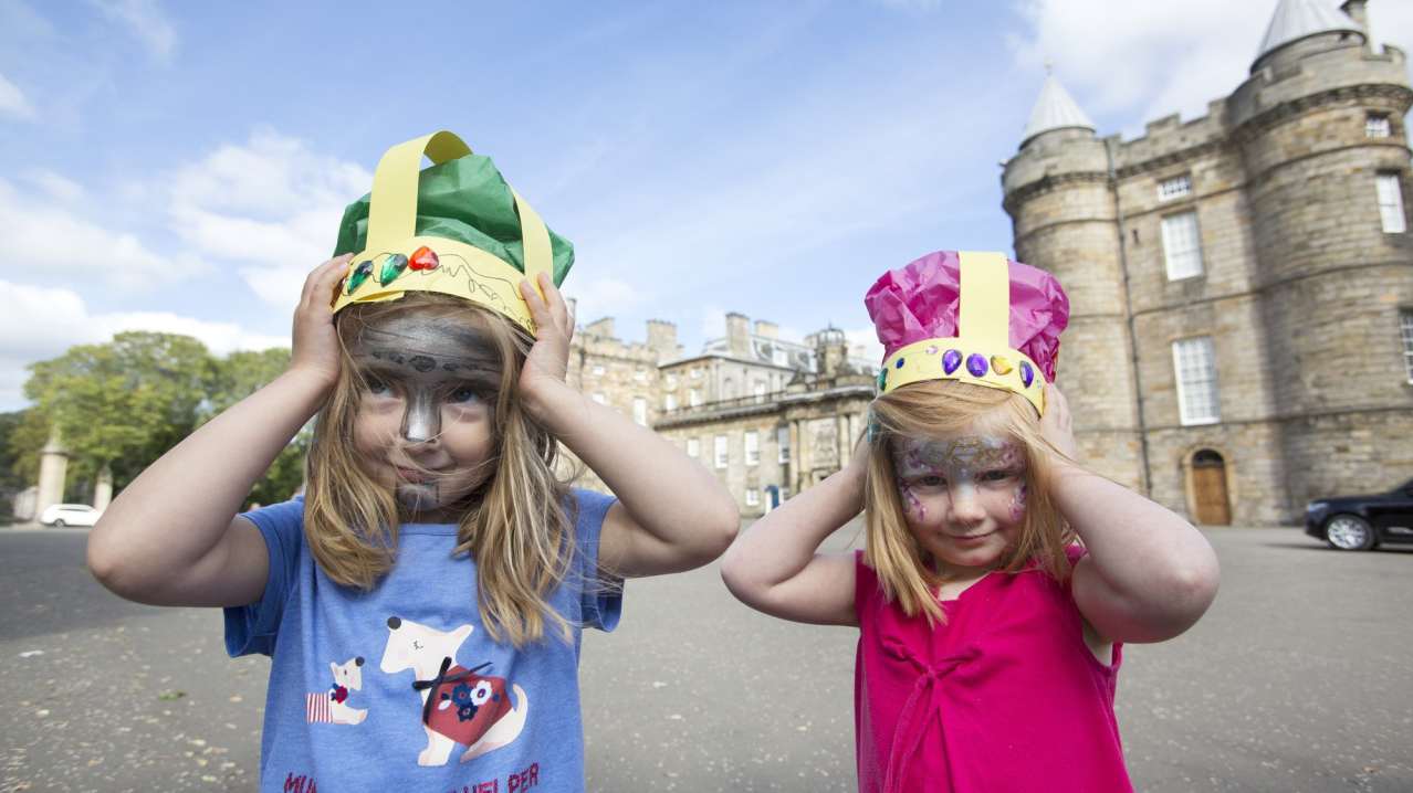 Girls with crowns at Palace of Holyroodhouse in Edinburgh