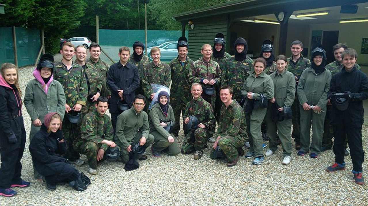 Young adults playing paintball at Arena Pursuits in Wadhurst