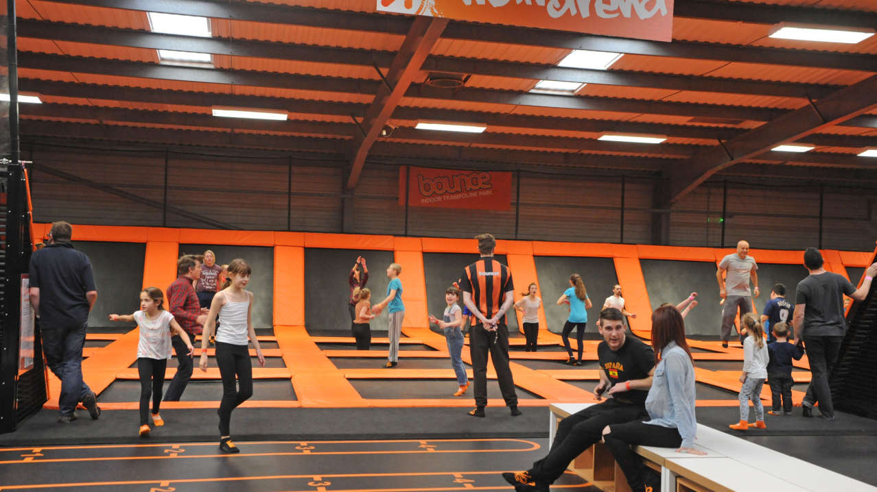 People jumping on trampolines at Bounce Indoor Trampoline Park in Milton Keynes
