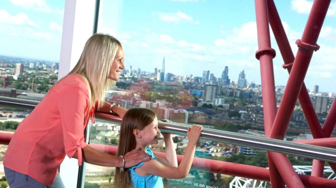Mum and daughter looking out The Slide at The ArcelorMittal Orbit in London