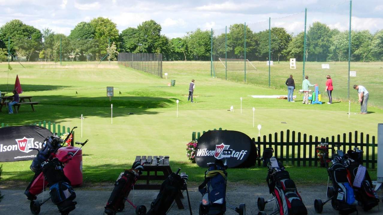 People playing mini golf at Stonehenge Mini Golf in Great Yarmouth