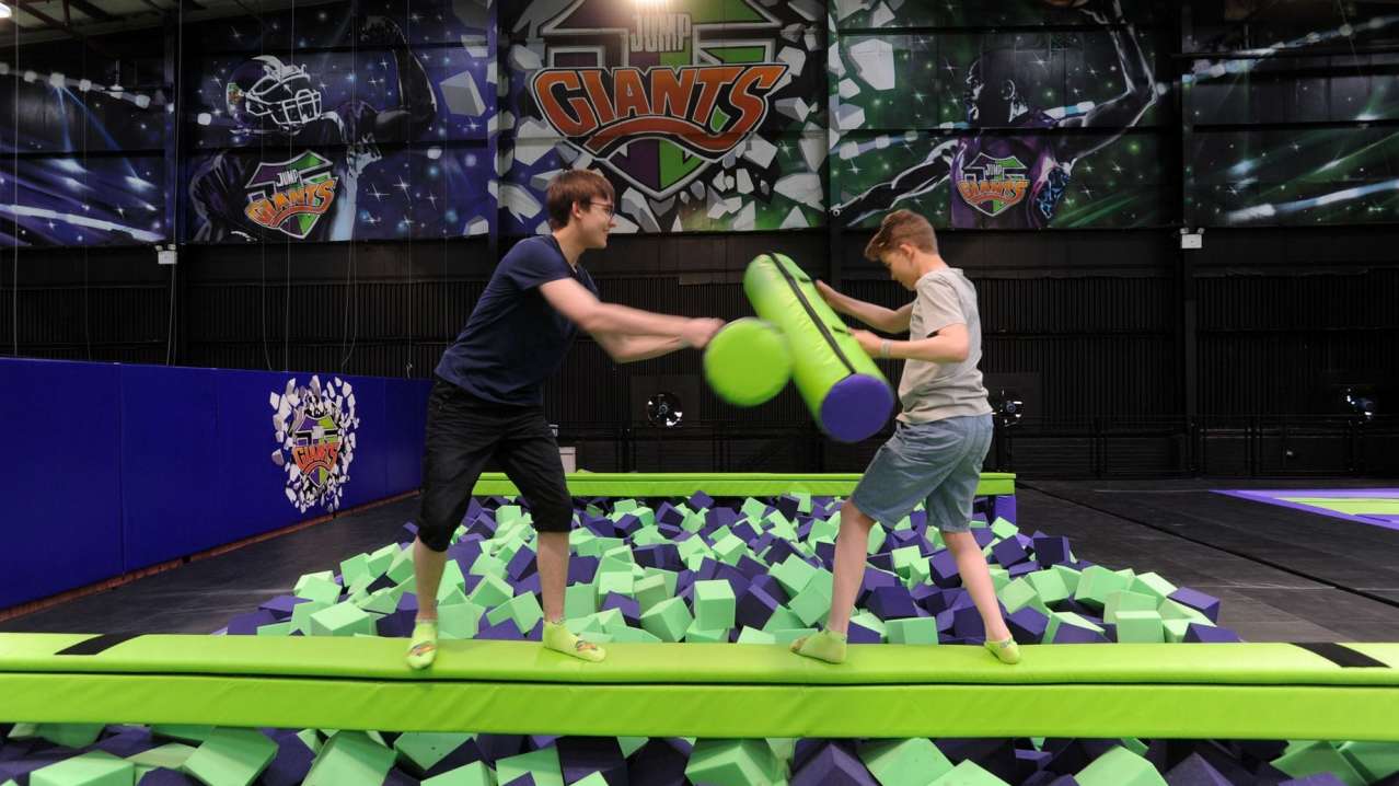 People on balance beam at Jump Giants West London in Slough