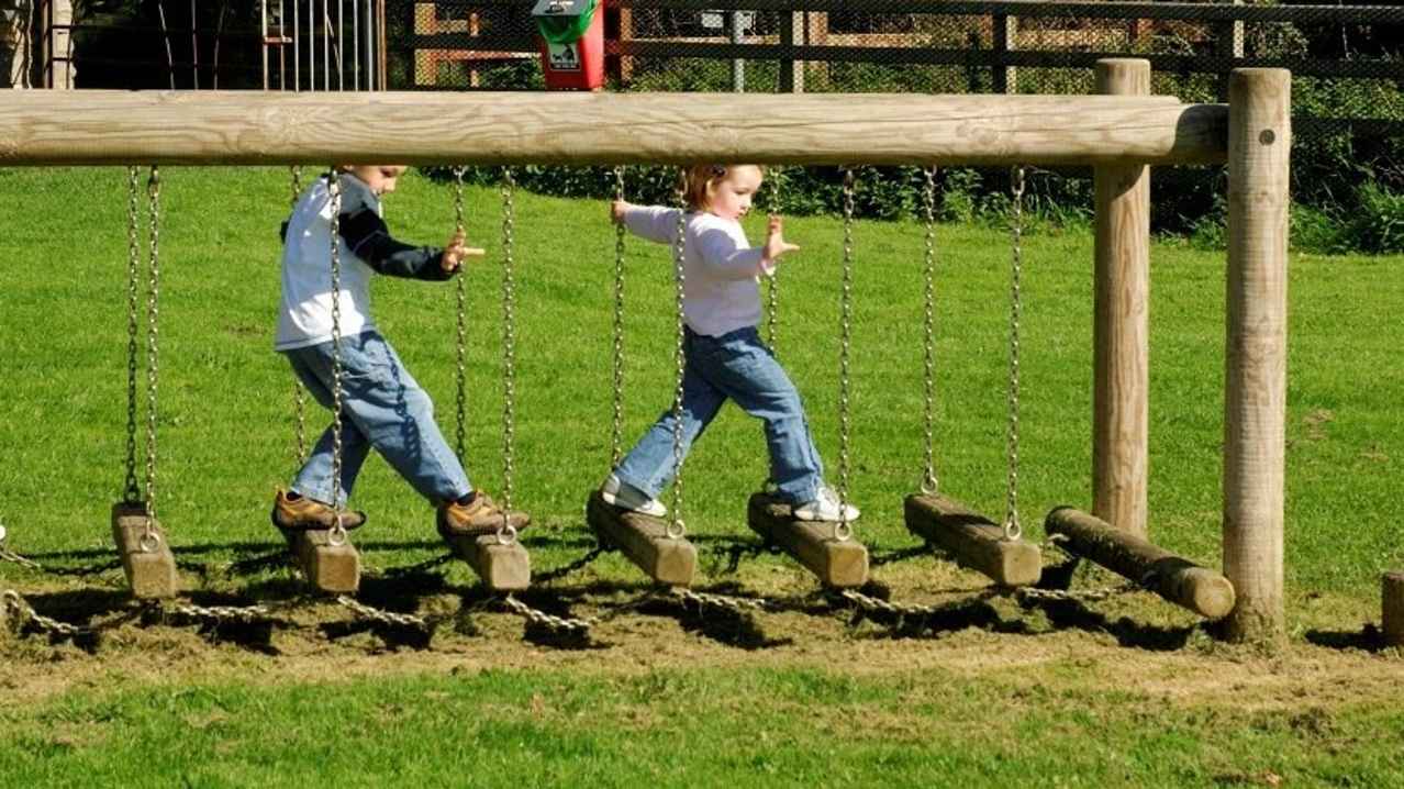 Kids on low rope bridge at Loughgall Country Park
