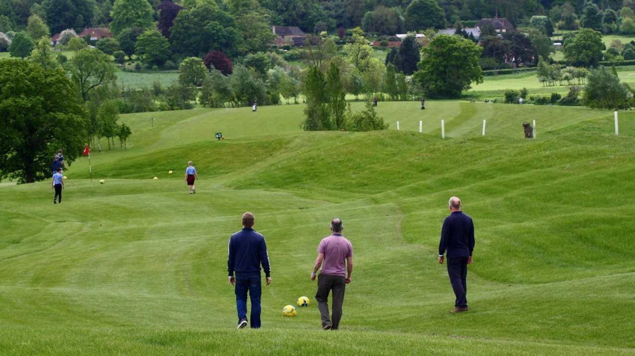 Men at Footgolf at Basset Down Golf Complex in Swindon Men at Footgolf at Basset Down Golf Complex in Swindon