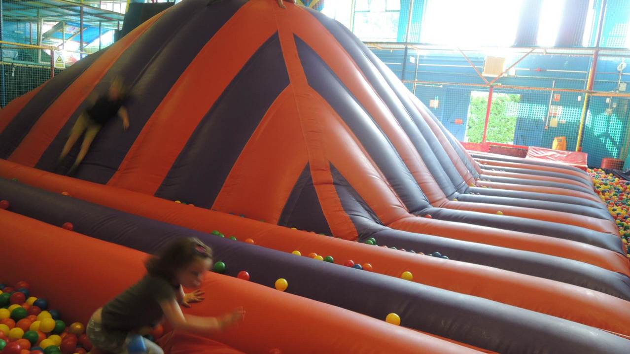 Kids sliding on inflatable at Kids Kingdom in Southend on Sea