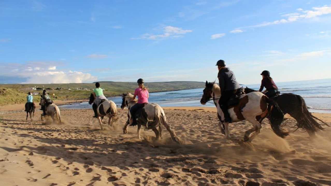 People horse riding on beach at Mountain View Trekking and Horse Riding at Lisdoonvarna People horse riding on beach at Mountain View Trekking and Horse Riding at Lisdoonvarna