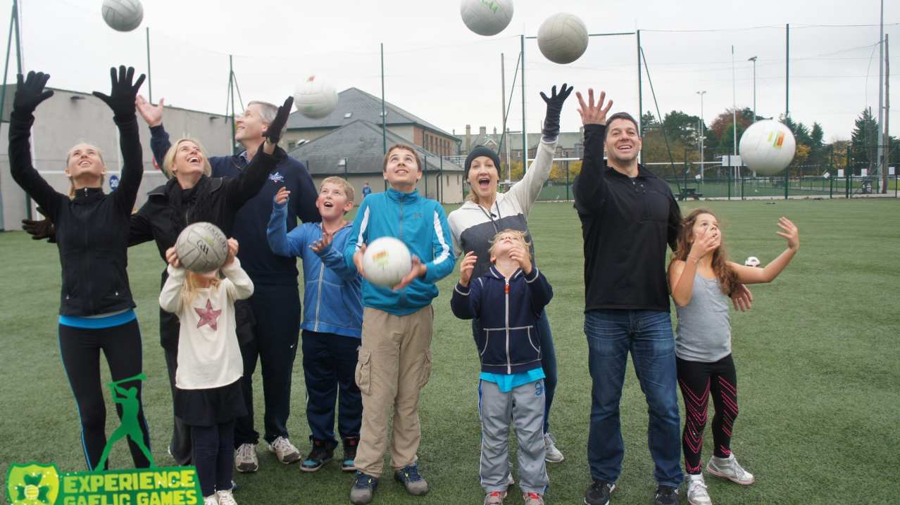 Family playing volleyball at Experience Gaelic Games in Dublin Family playing volleyball at Experience Gaelic Games in Dublin