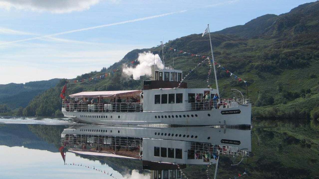 Tour boat at Loch Katrine in Stirling Tour boat at Loch Katrine in Stirling