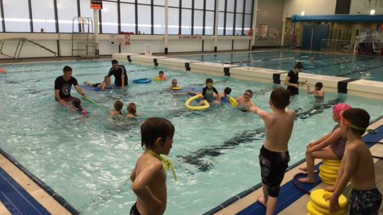 Families in swimming pool at Lewis Sports Centre in Isle of Lewis Families in swimming pool at Lewis Sports Centre in Isle of Lewis