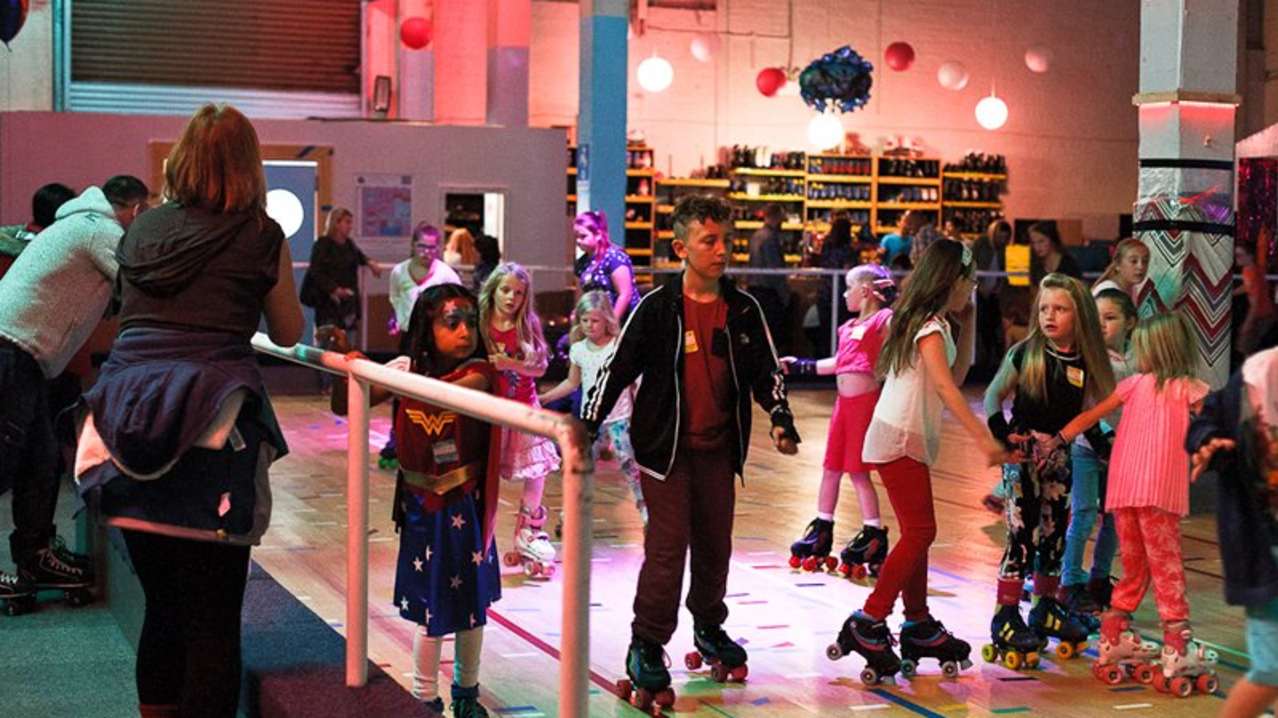 People rollerskating at RollerStop Roller Rink in Glasgow People rollerskating at RollerStop Roller Rink in Glasgow