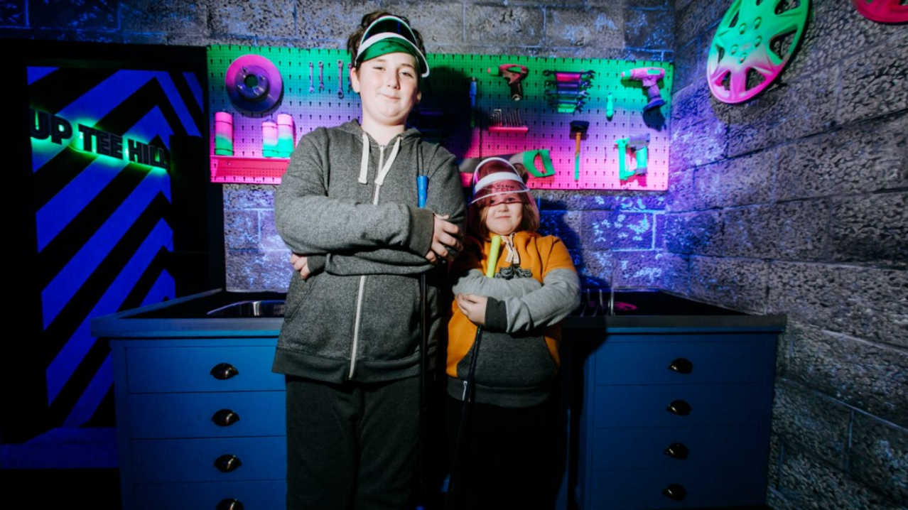Two kids posing at Putt Club Crazy Golf in Hull Two kids posing at Putt Club Crazy Golf in Hull