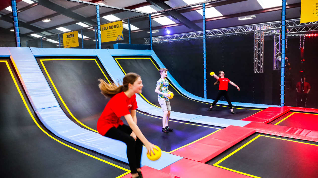 A group of kids playing dodgeball at Redkangaroo A group of kids playing dodgeball at Redkangaroo