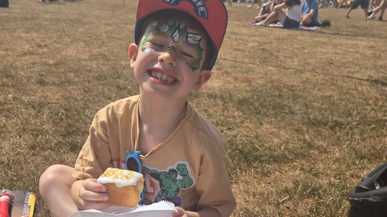 Olly enjoying the music and cake.