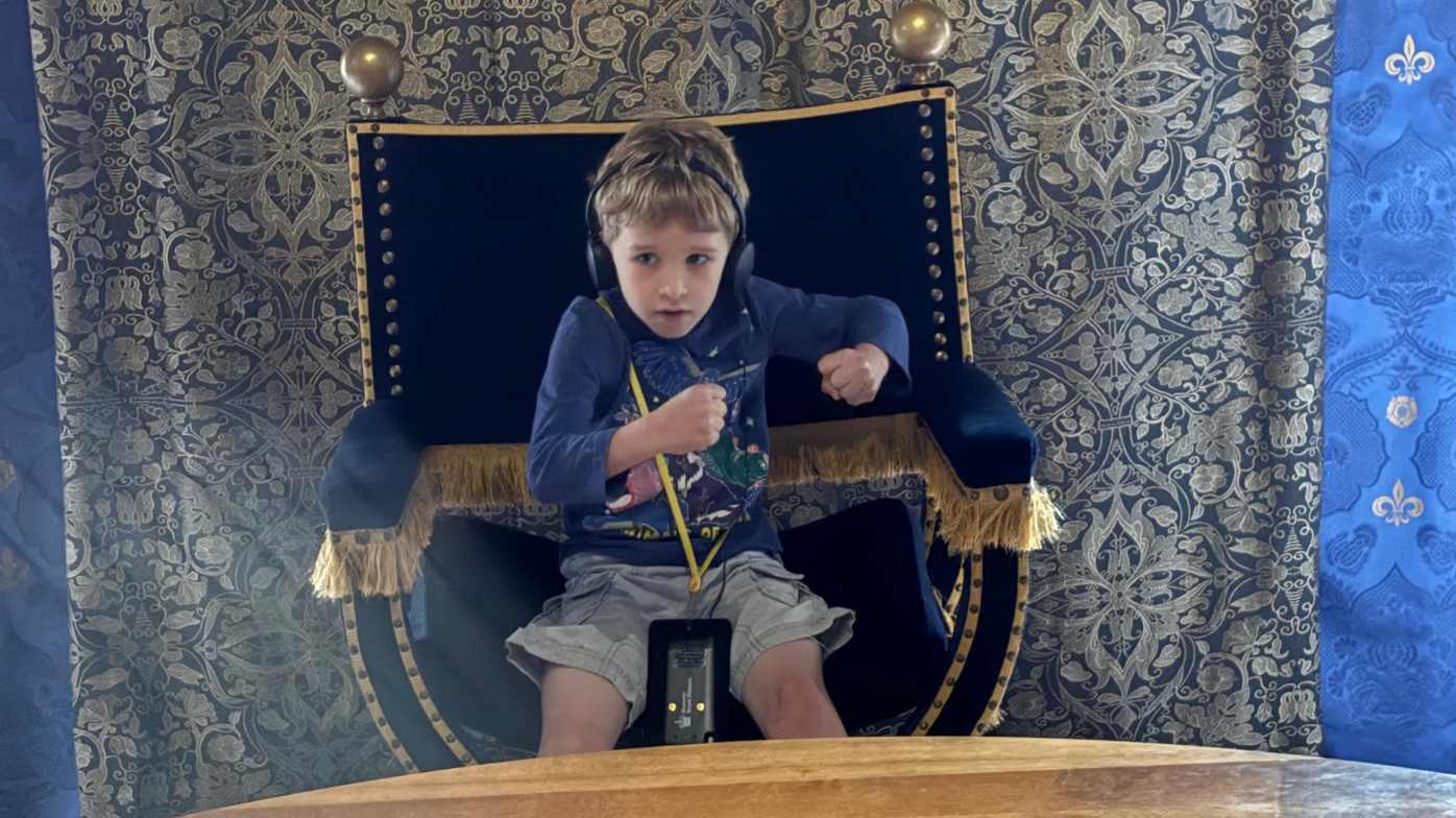 Sitting in Henry VIIIs chair at the table