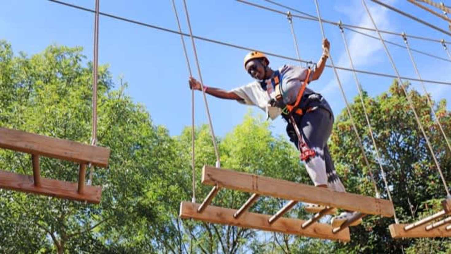 person tackling the high ropes course at Gripped London, Hounslow