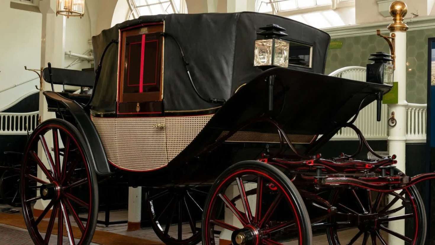 Historic royal carriage on display at the Royal Mews, used for ceremonial and state occasions at Buckingham Palace