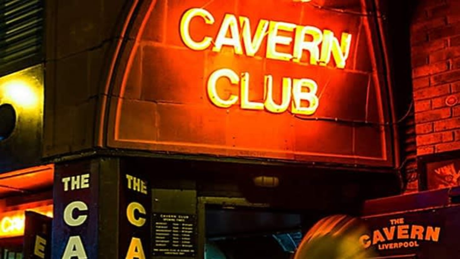 Neon Cavern Club sign at the entrance on Mathew Street, Liverpool.