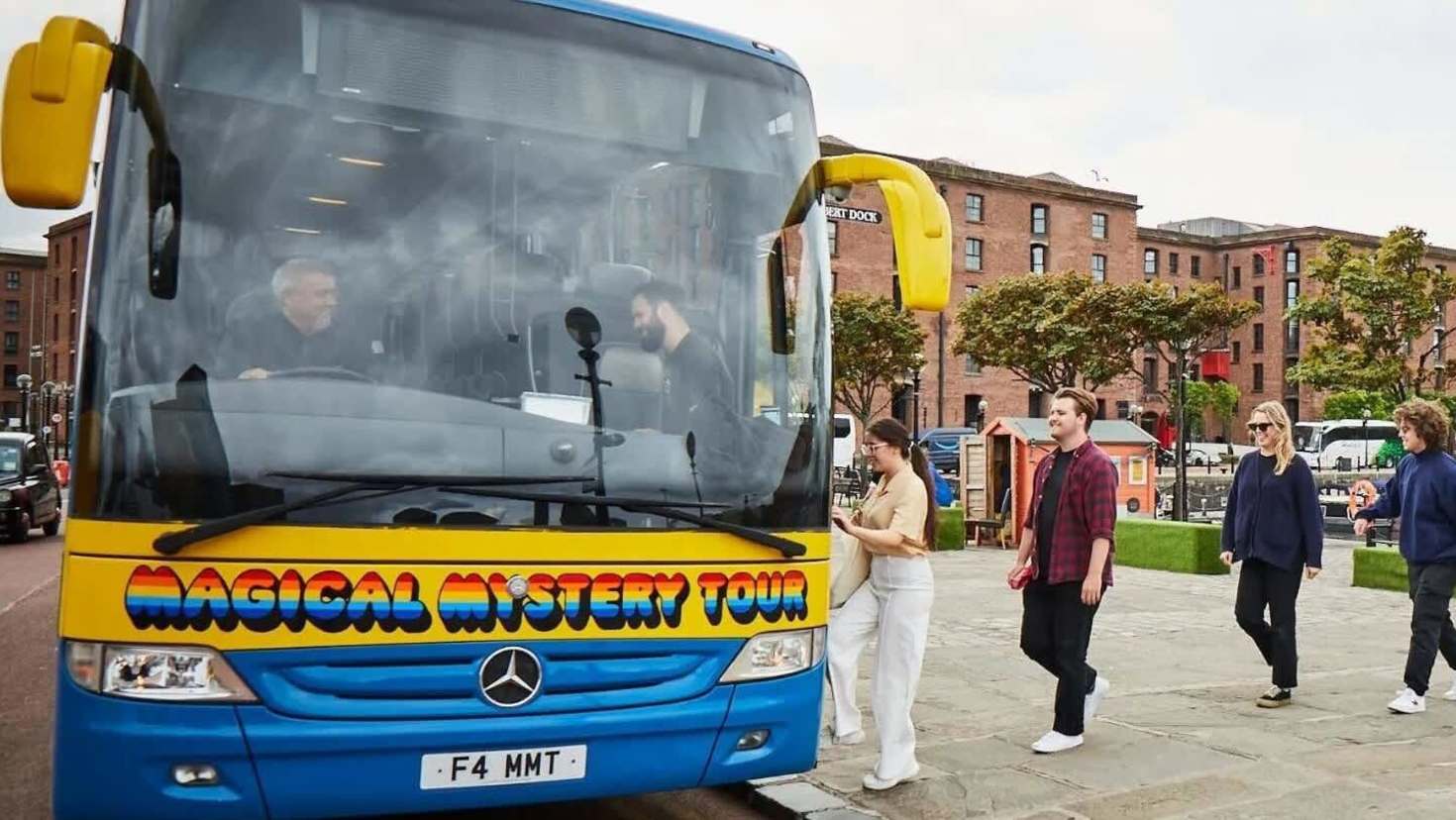 Passengers boarding the Magical Mystery Tour coach at Albert Dock, Liverpool.