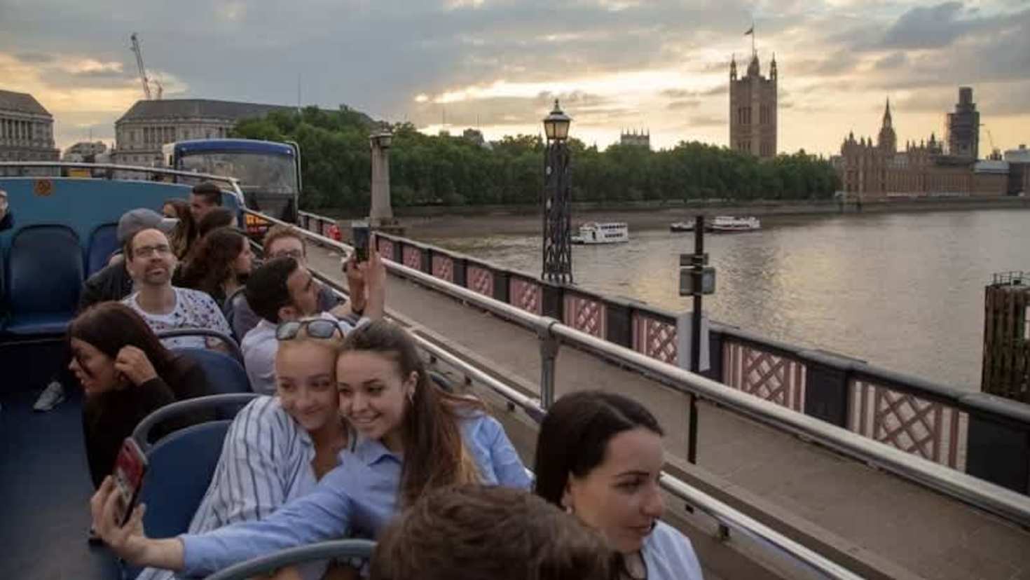 Passengers enjoying illuminated London landmarks on the Taylor Swift Singalong Bus Tour.